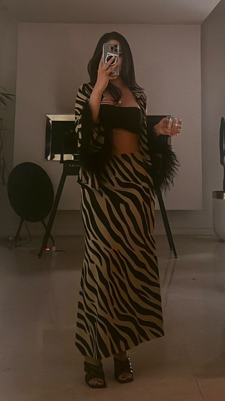 Mirror photograph of a person wearing a patterned coordinated outfit